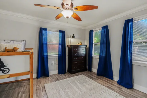 a bedroom with a bed and a dresser