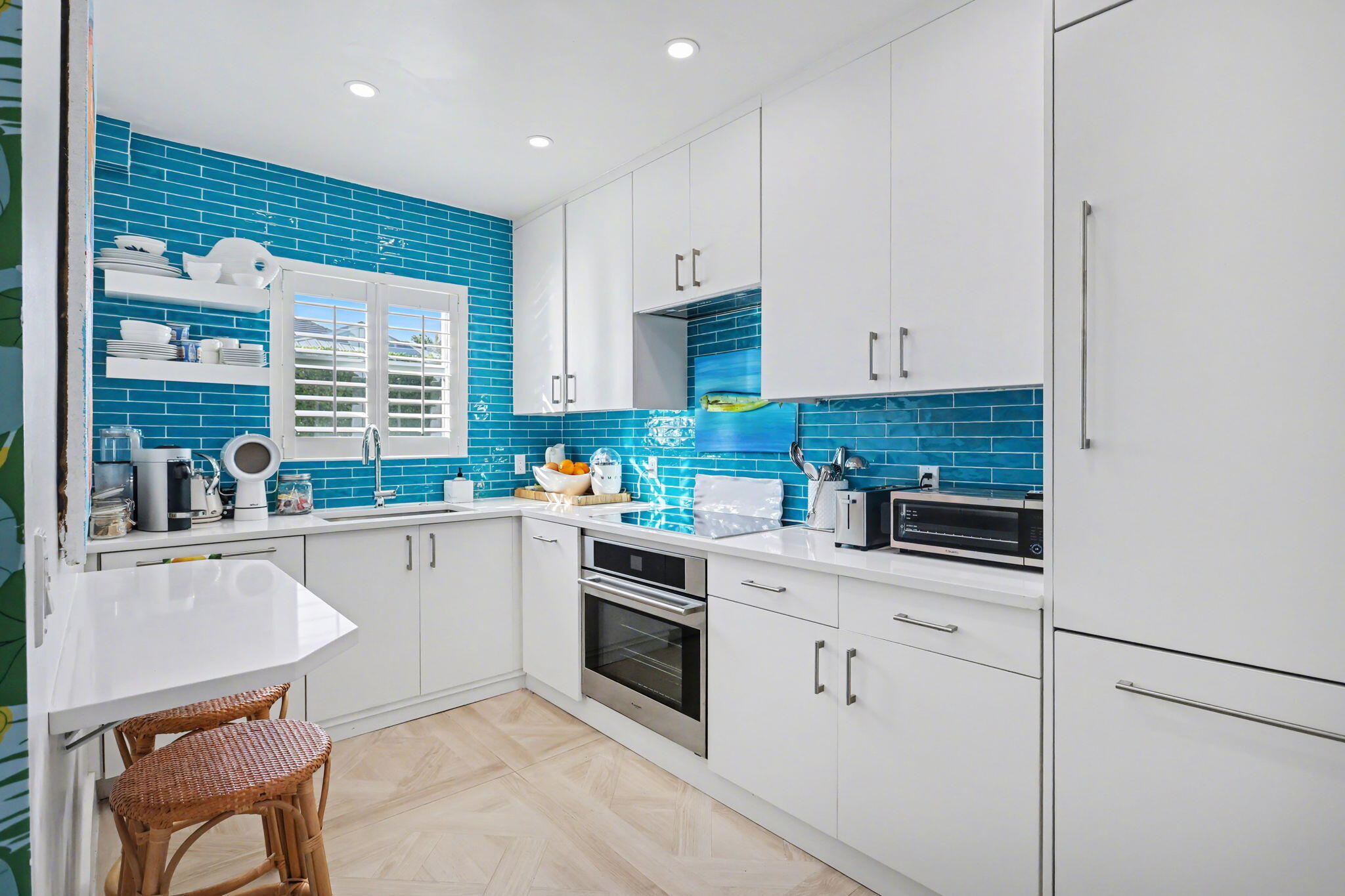 202 Gleason Street, Unit 3 Delray Beach, FL 33483 - Photo 12 of 34 a kitchen with granite countertop white cabinets and white appliances