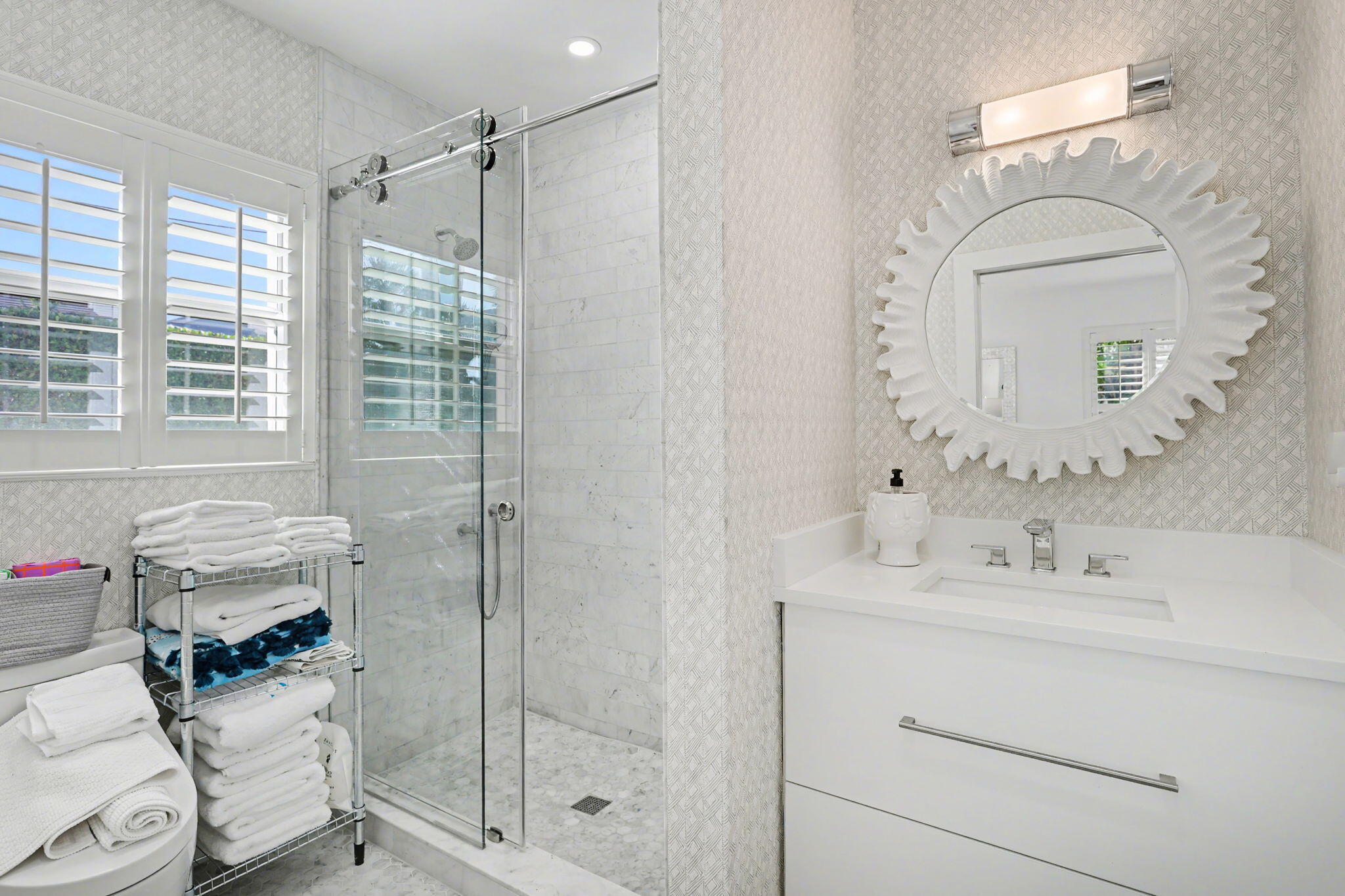 202 Gleason Street, Unit 3 Delray Beach, FL 33483 - Photo 20 of 34 a bathroom with a sink mirror and a shower