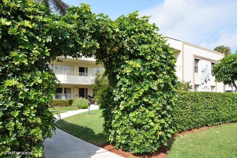 202 Gleason Street, Unit 3 Delray Beach, FL 33483 - Photo 22 of 34 a front view of a house with garden