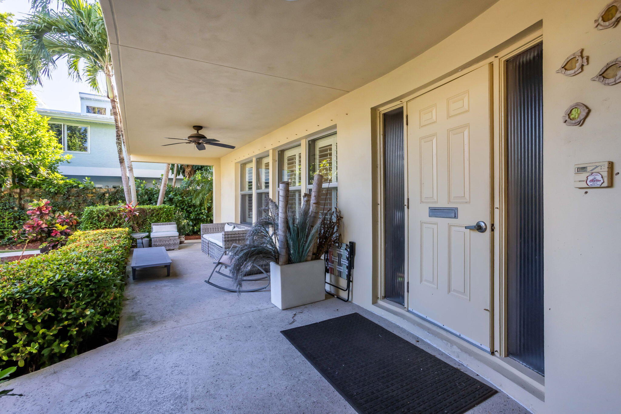 202 Gleason Street, Unit 3 Delray Beach, FL 33483 - Photo 4 of 34 a view of a patio with couches and potted plants