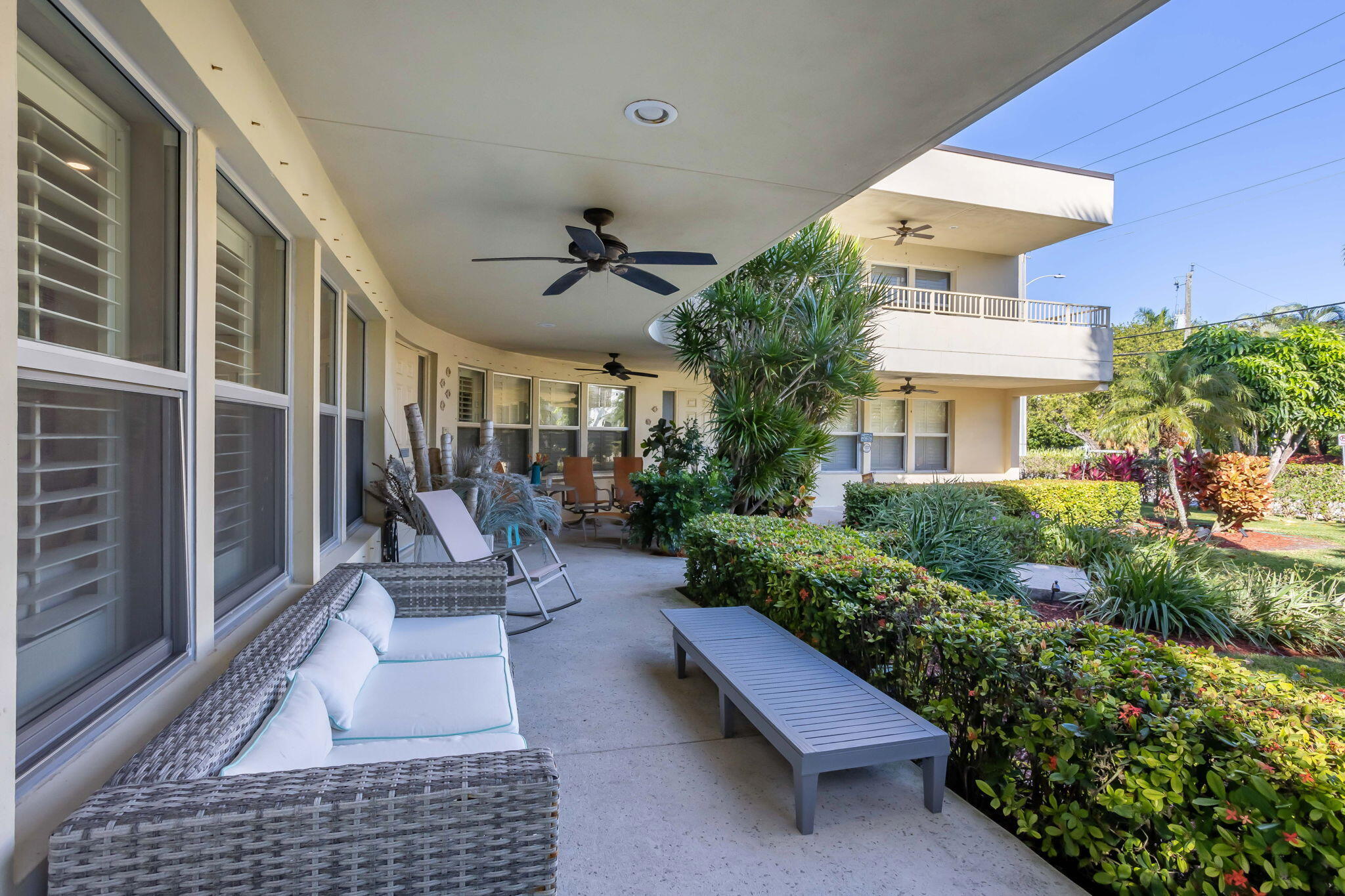 202 Gleason Street, Unit 3 Delray Beach, FL 33483 - Photo 5 of 34 a view of a patio with couches table and chairs and potted plants