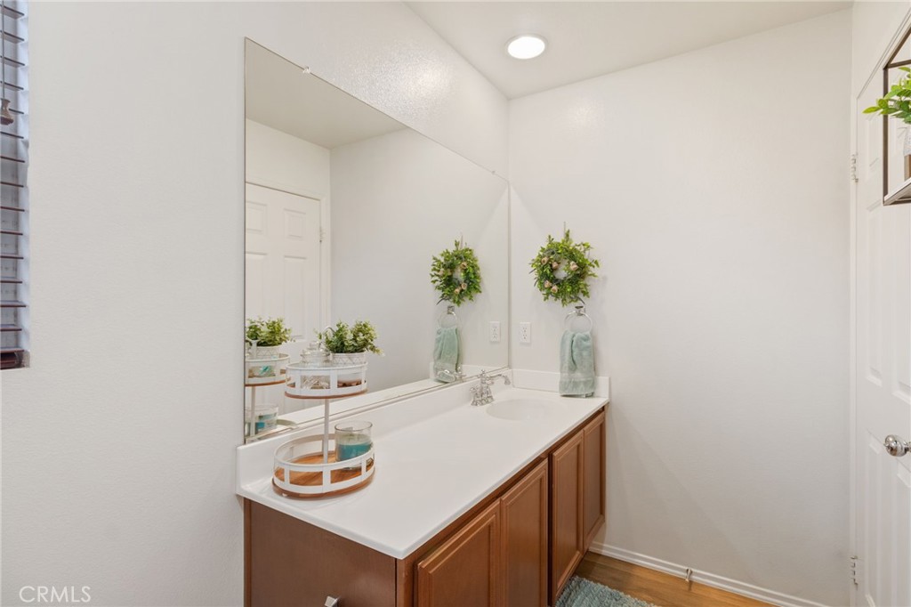 641 Amaranta Avenue Perris, CA 92571 - Photo 20 of 31 a bathroom with a sink and a mirror