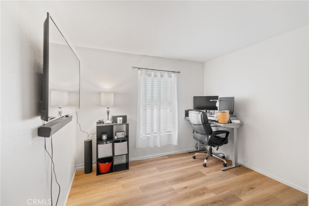 641 Amaranta Avenue Perris, CA 92571 - Photo 23 of 31 a view of a workspace with furniture and a window
