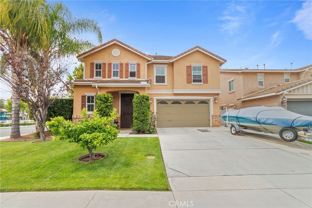 641 Amaranta Avenue Perris, CA 92571 - Photo 28 of 31 a view of a house with a yard and sitting area