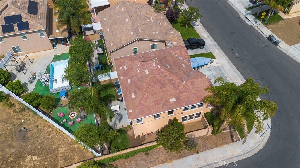 641 Amaranta Avenue Perris, CA 92571 - Photo 29 of 31 an aerial view of a house with a yard and potted plants