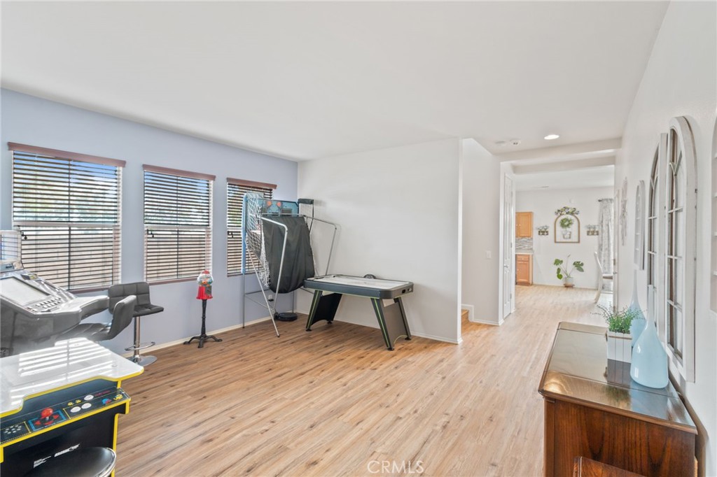 641 Amaranta Avenue Perris, CA 92571 - Photo 3 of 31 a bedroom with furniture and a wooden floor