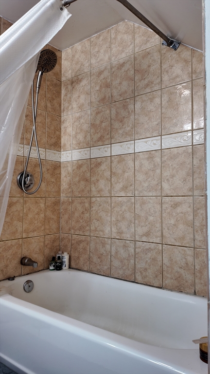 97 Seamans Street, Unit 2 Providence, RI 02908 - Photo 6 of 9 a bathroom with a bathtub and shower