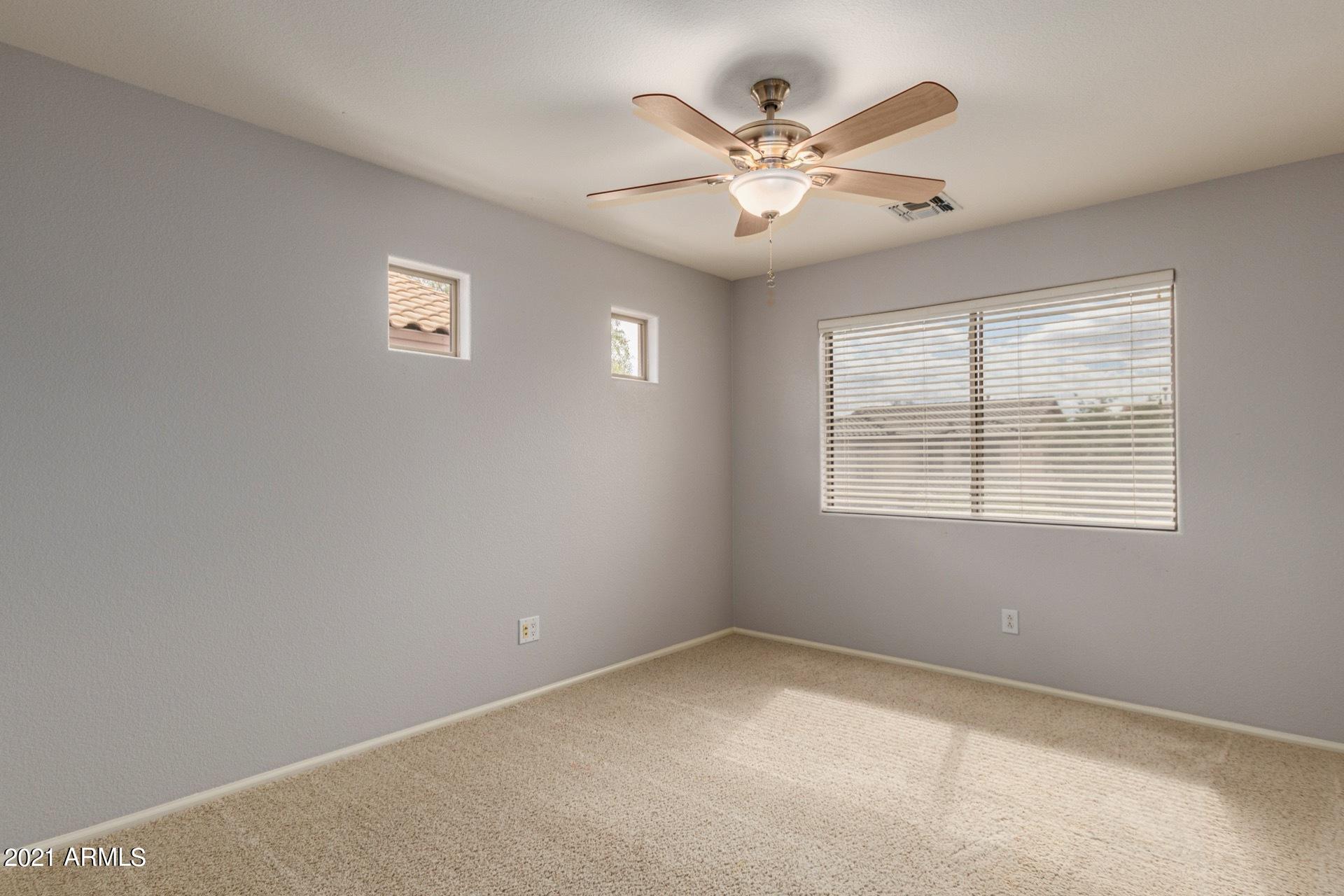 2438 West Running Deer Trail Phoenix, AZ 85085 - Photo 14 of 28 an empty room with a window