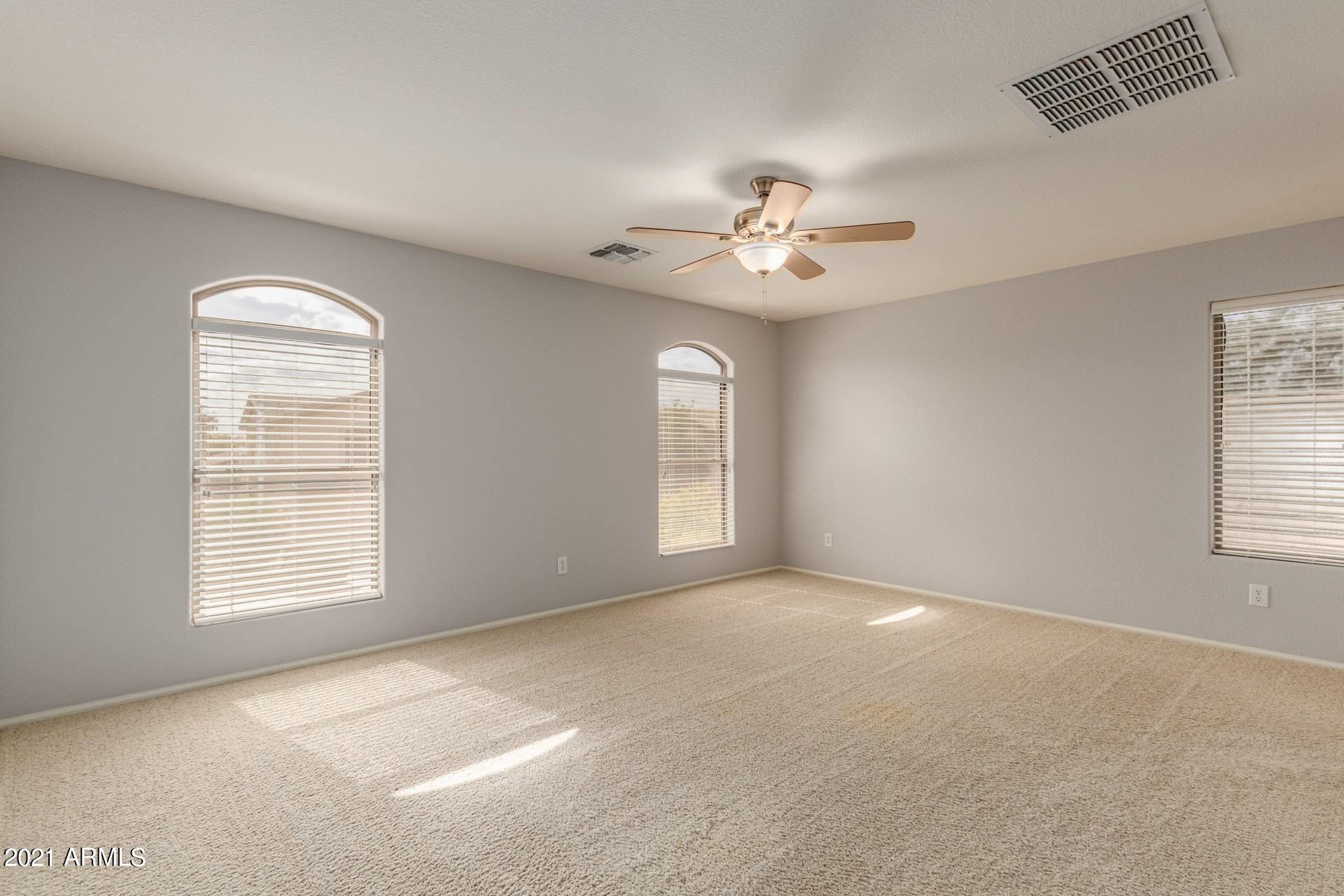 2438 West Running Deer Trail Phoenix, AZ 85085 - Photo 19 of 28 a view of an empty room with a window