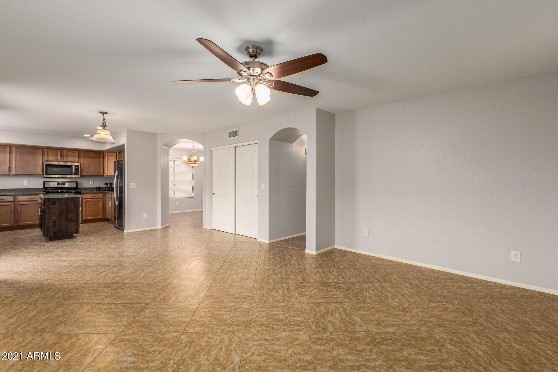 2438 West Running Deer Trail Phoenix, AZ 85085 - Photo 7 of 28 a view of a livingroom with a ceiling fan