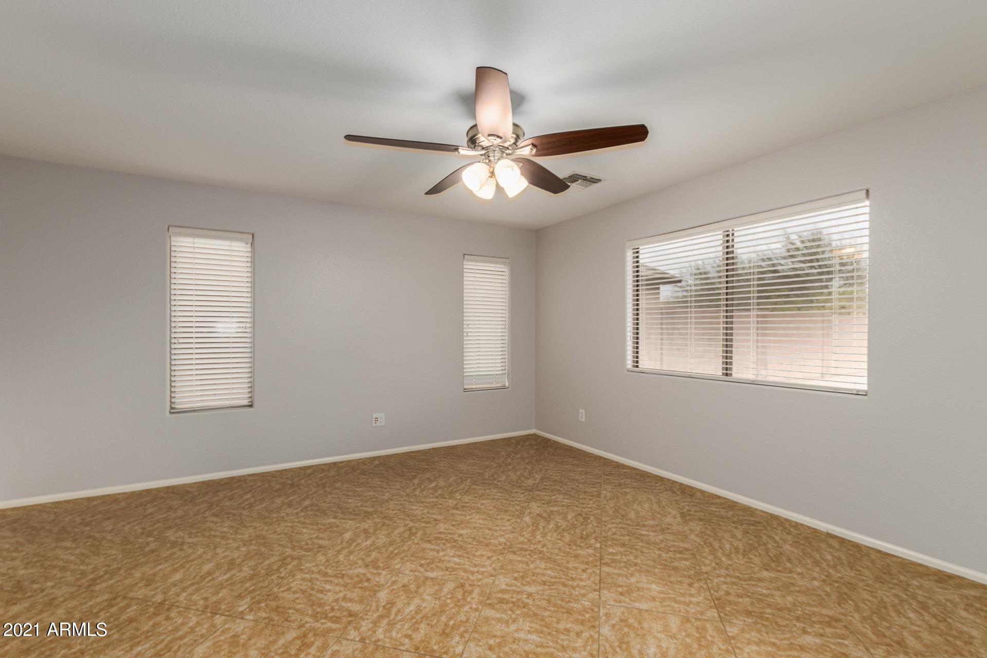 2438 West Running Deer Trail Phoenix, AZ 85085 - Photo 8 of 28 a view of an empty room with a window