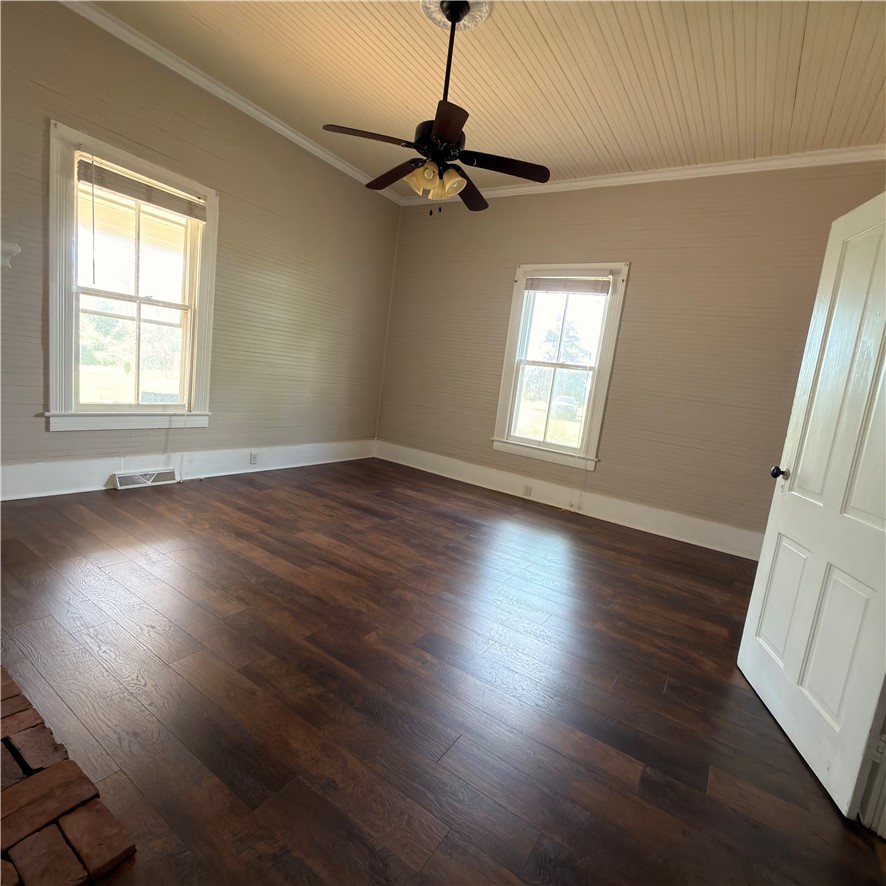 1014 Levis Smith Road Pendleton, SC 29670 - Photo 19 of 21 This inviting room features rich wood flooring and abundant natural light through classic windows.