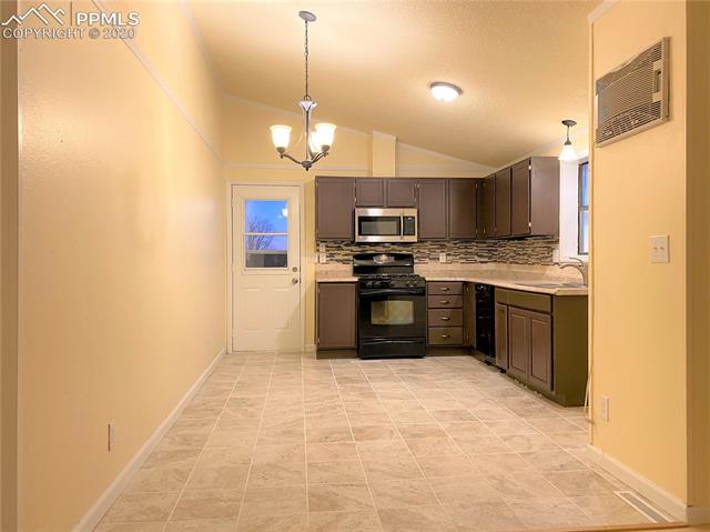 3255 Wiesner Road Calhan, CO 80808 - Photo 14 of 25 Lovely Kitchen & Dining... Newly Updated Kitchen features: tile flooring, light fixtures, backsplash, refinished cabinets, dishwasher, pull-out faucet & plumbing.