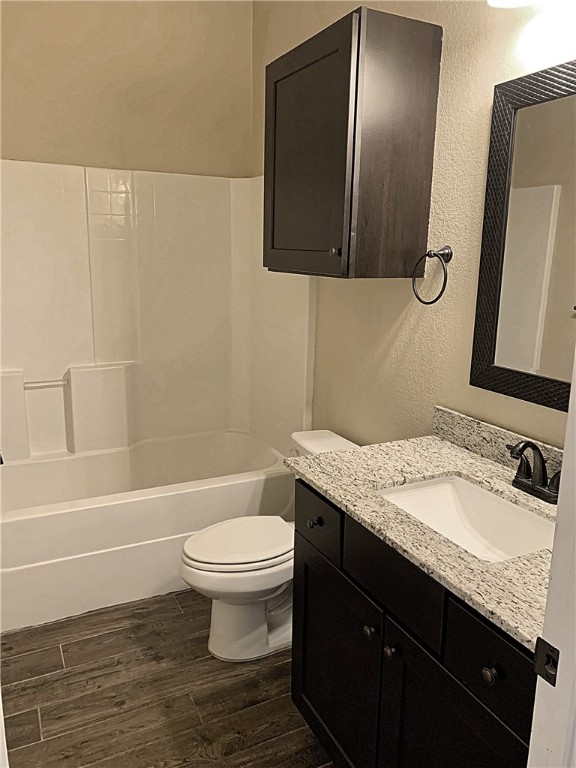301 Southwest Parkway, Unit 351 College Station, TX 77840 - Photo 7 of 10 a bathroom with a granite countertop sink toilet and shower