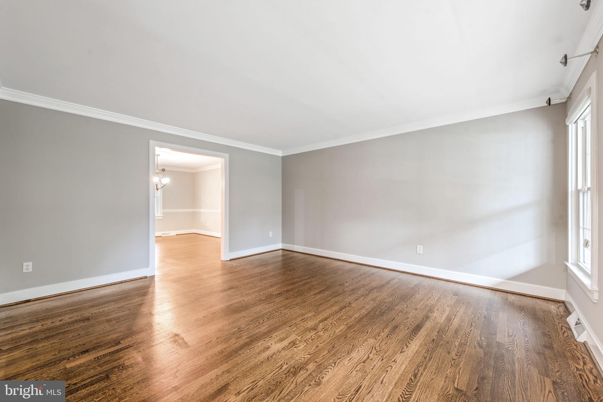 2821 Rifle Ridge Road Oakton, VA 22124 - Photo 6 of 56 Living room with crown molding & double windows