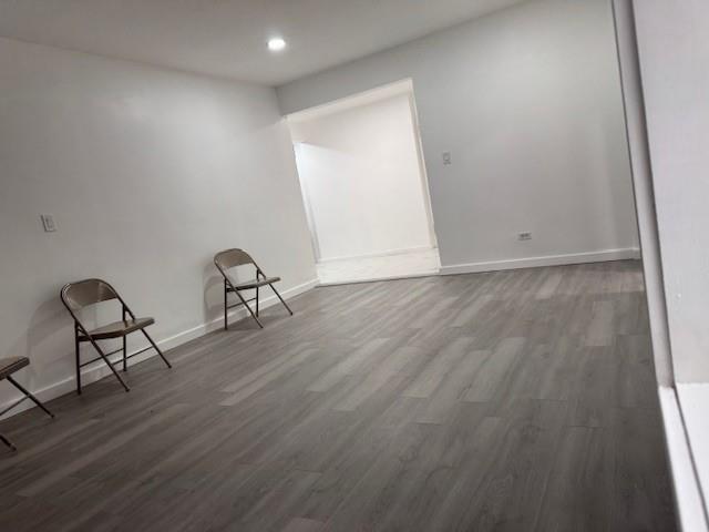 44-05 Macnish Street, Unit 1E Queens, NY 11373 - Photo 4 of 7 a view of a room with wooden floor and furniture