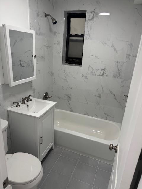 44-05 Macnish Street, Unit 1E Queens, NY 11373 - Photo 6 of 7 a bathroom with a sink mirror vanity and toilet