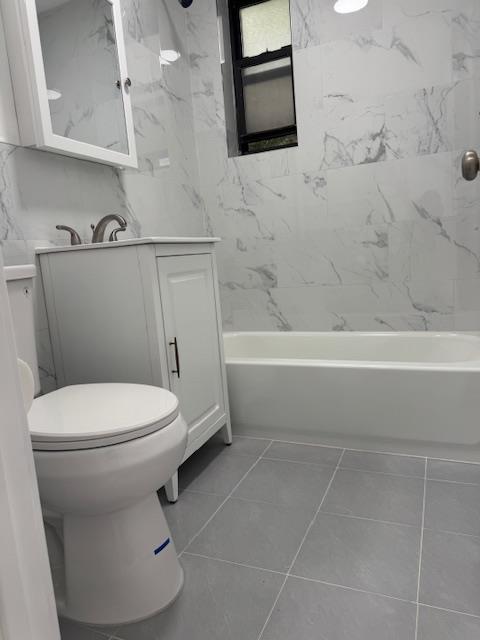 44-05 Macnish Street, Unit 1E Queens, NY 11373 - Photo 7 of 7 a bathroom with a toilet a sink and bathtub