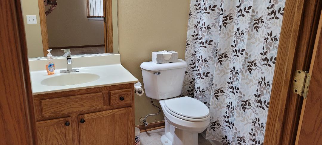 1528 Ludington Circle Romeoville, IL 60446 - Photo 14 of 22 a bathroom with a sink toilet and a mirror