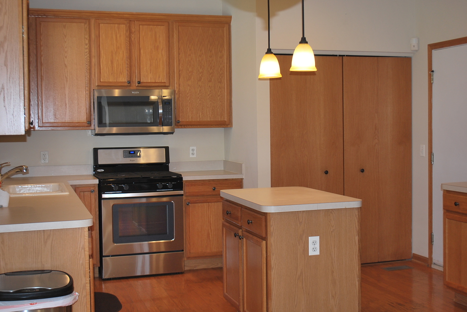 1528 Ludington Circle Romeoville, IL 60446 - Photo 5 of 22 a kitchen with stainless steel appliances a stove a microwave and a refrigerator
