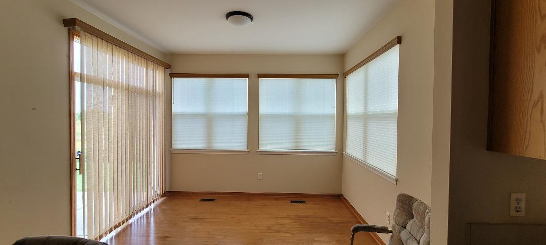 1528 Ludington Circle Romeoville, IL 60446 - Photo 8 of 22 a view of an empty room with a window