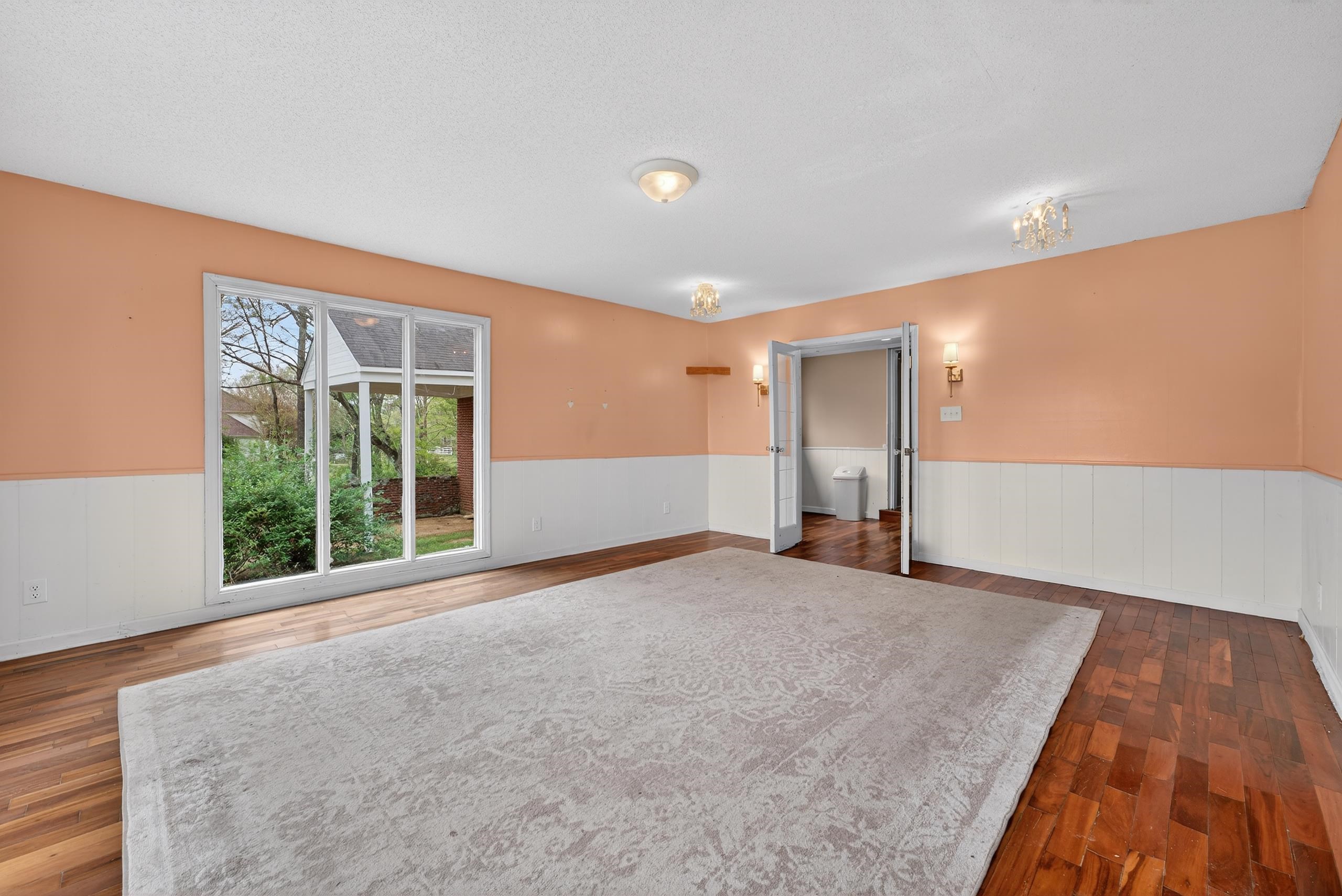 700 North Reid Hooker Road Eads, TN 38028 - Photo 14 of 20 Spare room with wainscoting and dark wood finished floors