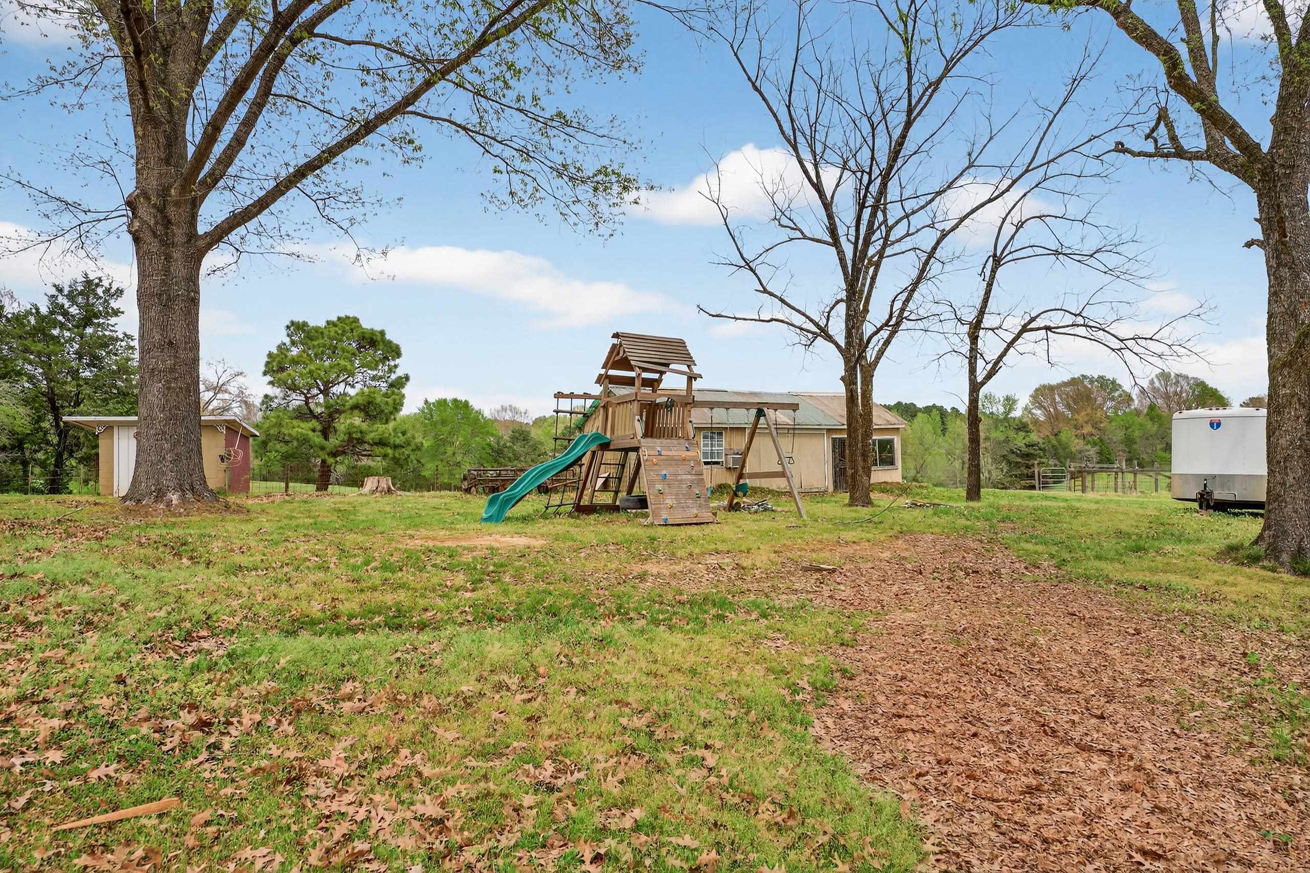 700 North Reid Hooker Road Eads, TN 38028 - Photo 18 of 20 View of green lawn featuring a playground