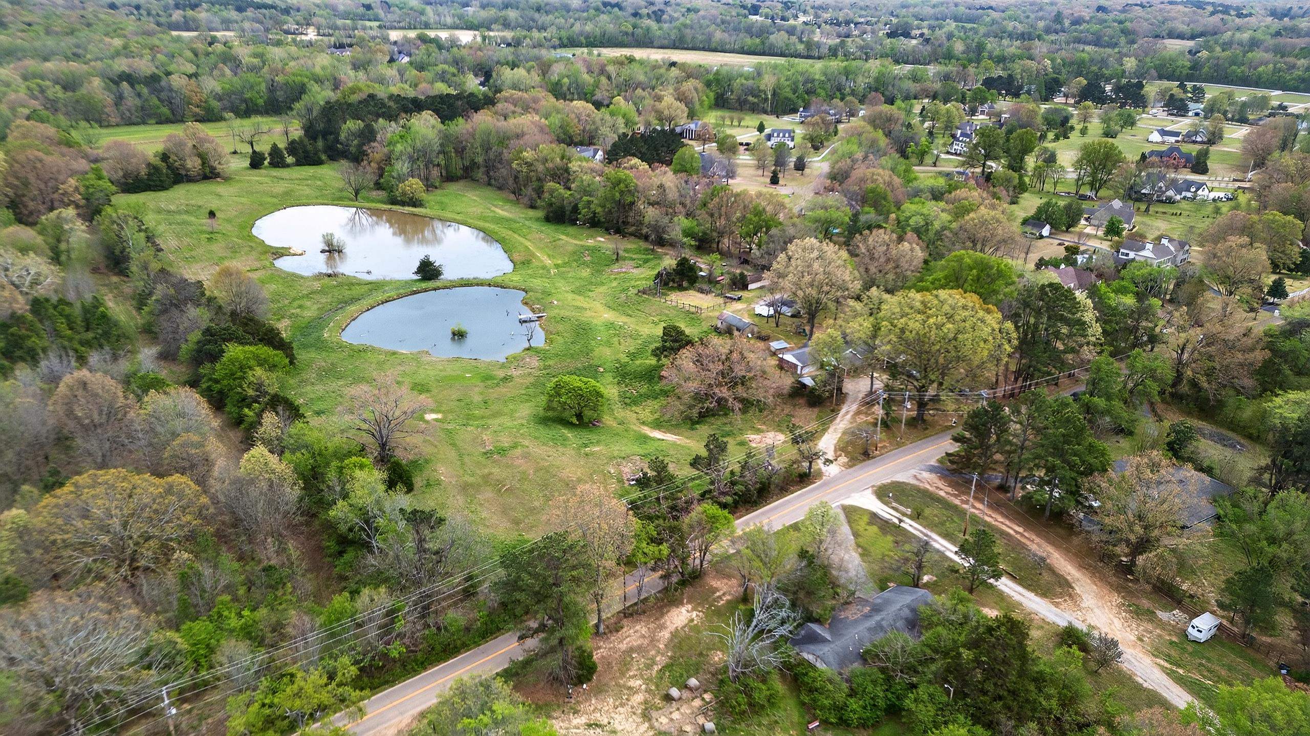 700 North Reid Hooker Road Eads, TN 38028 - Photo 20 of 20 Bird's eye view of a nearby body of water and a tree filled landscape