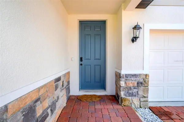 a view of front door with wooden floor