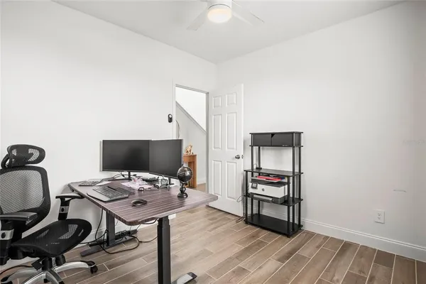 a view of a workspace with furniture
