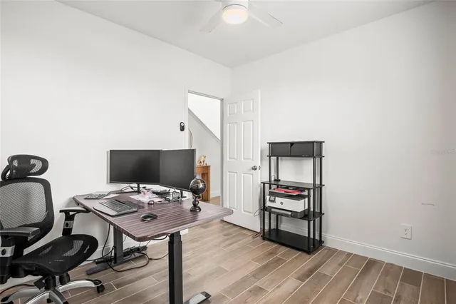 a view of a workspace with furniture