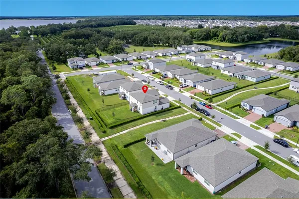 an aerial view of a house with a garden