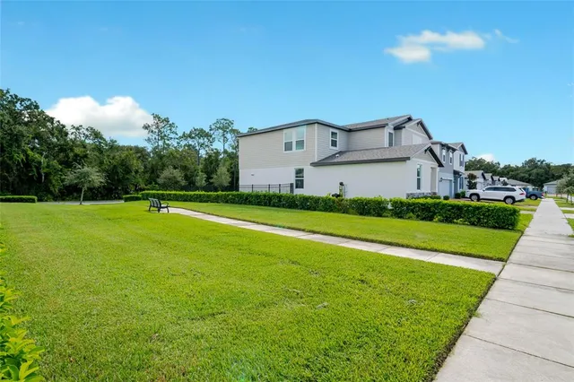 a view of a house with a big yard