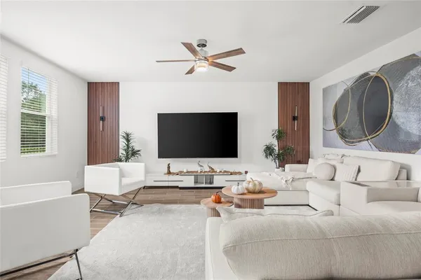 a living room with furniture and a flat screen tv