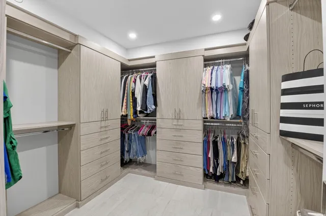 a bathroom with a sink toilet and mirror