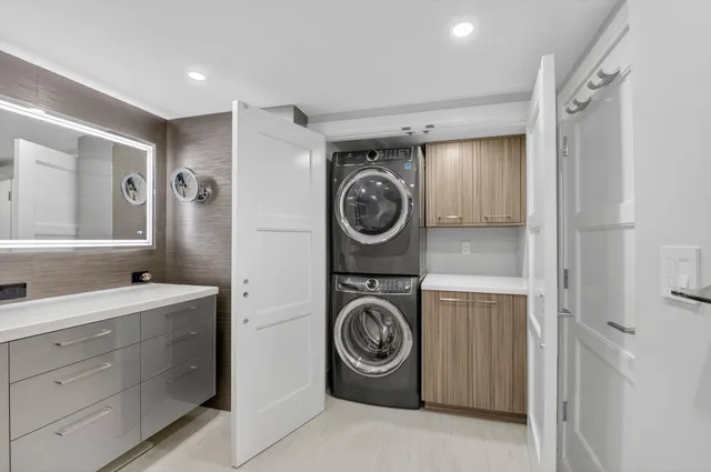 an aerial view of a house with garden space and street view