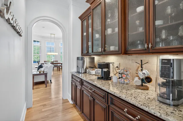 a spacious bedroom with a bed and a chandelier