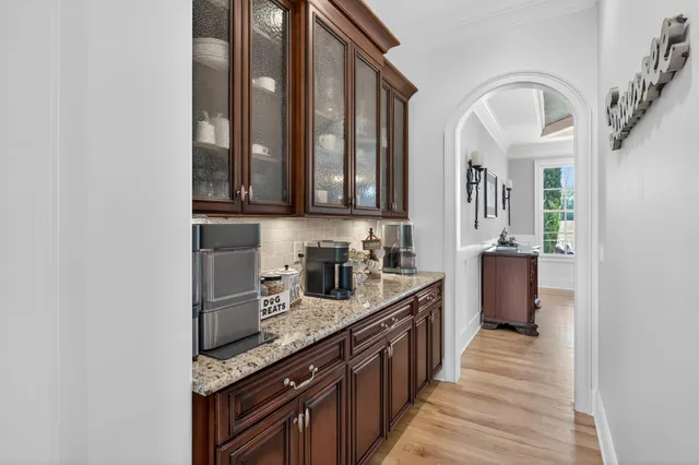 a spacious bedroom with a bed and a flat screen tv