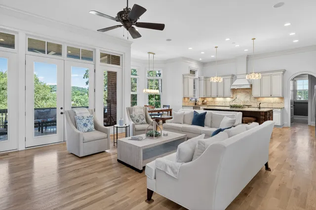 a bathroom with a granite countertop sink a mirror and a shower