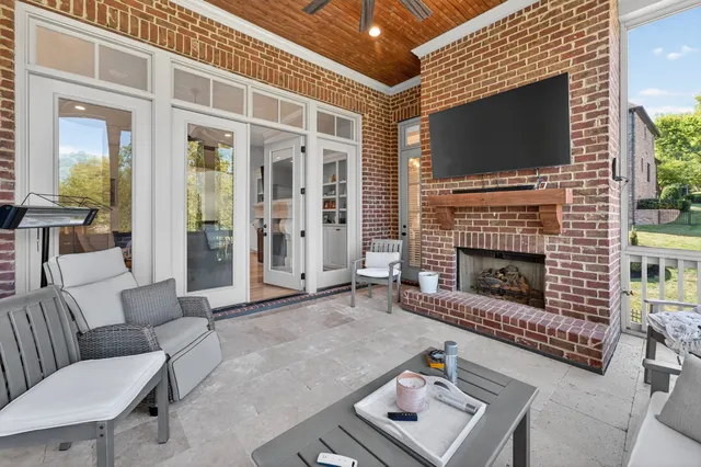a bathroom with a granite countertop sink mirror vanity and toilet