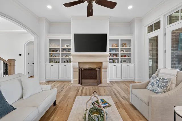 a spacious bedroom with a bed and a chandelier
