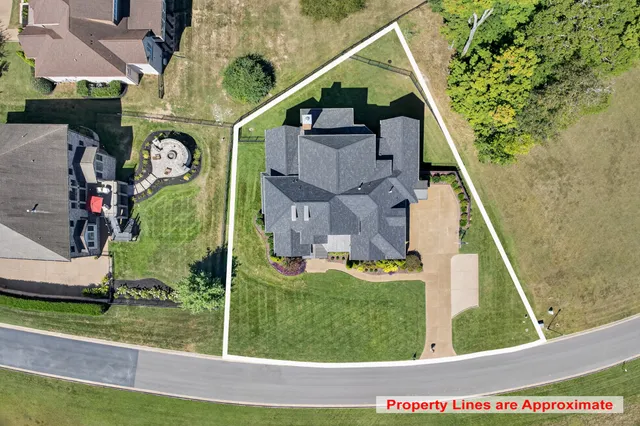 a view of a dining room with furniture wooden floor and chandelier