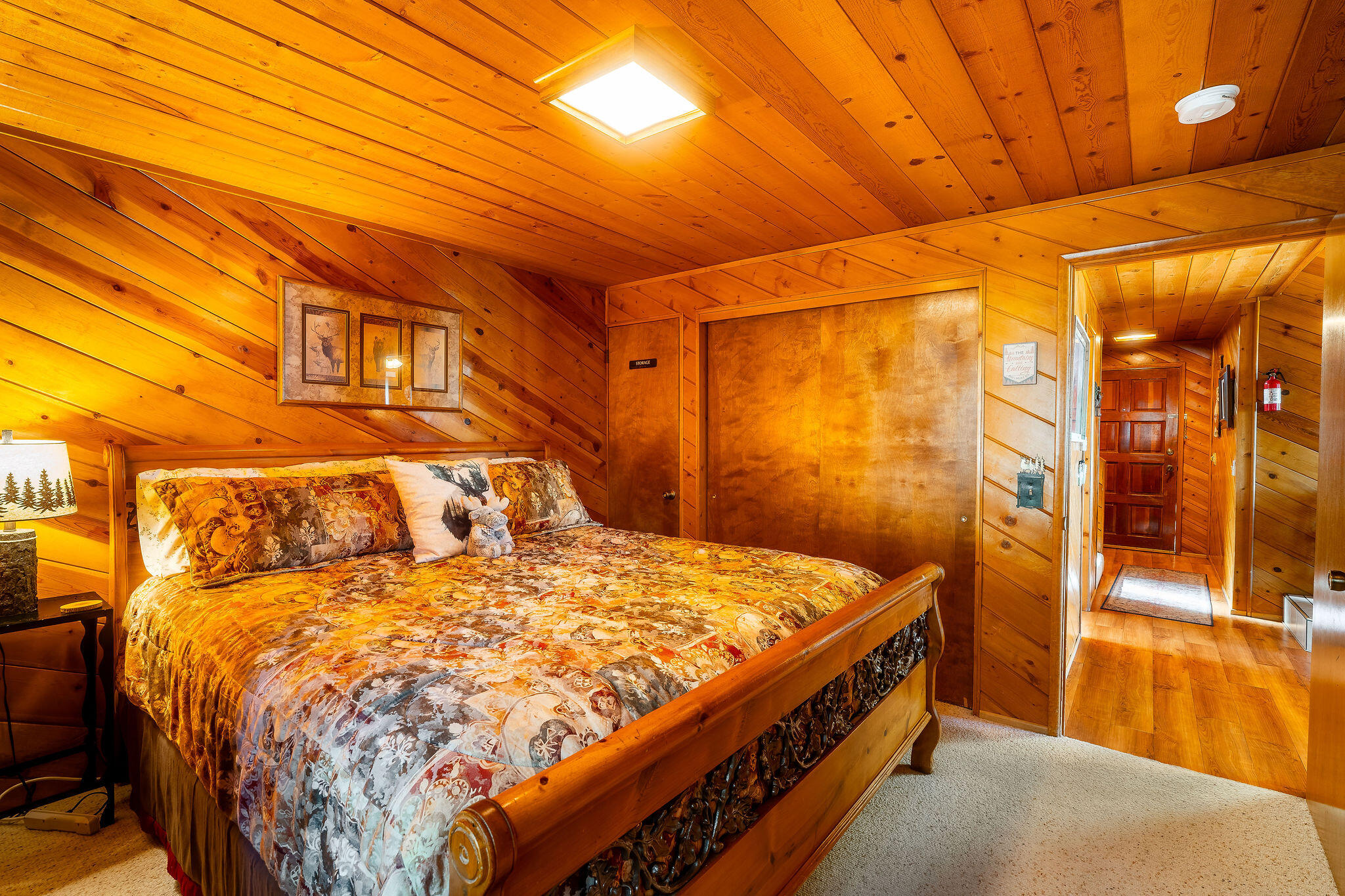 24675 Rocky Point Road Idyllwild, CA 92549 - Photo 16 of 64 a bed sitting in a bedroom next to a bathroom