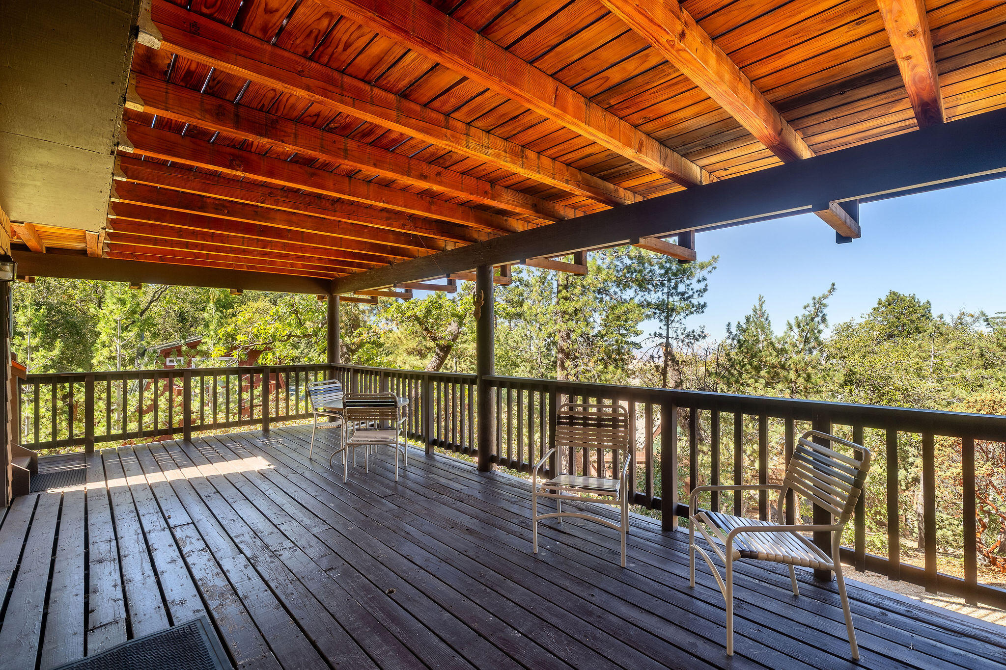 24675 Rocky Point Road Idyllwild, CA 92549 - Photo 32 of 64 a porch with wooden floor in outdoor space