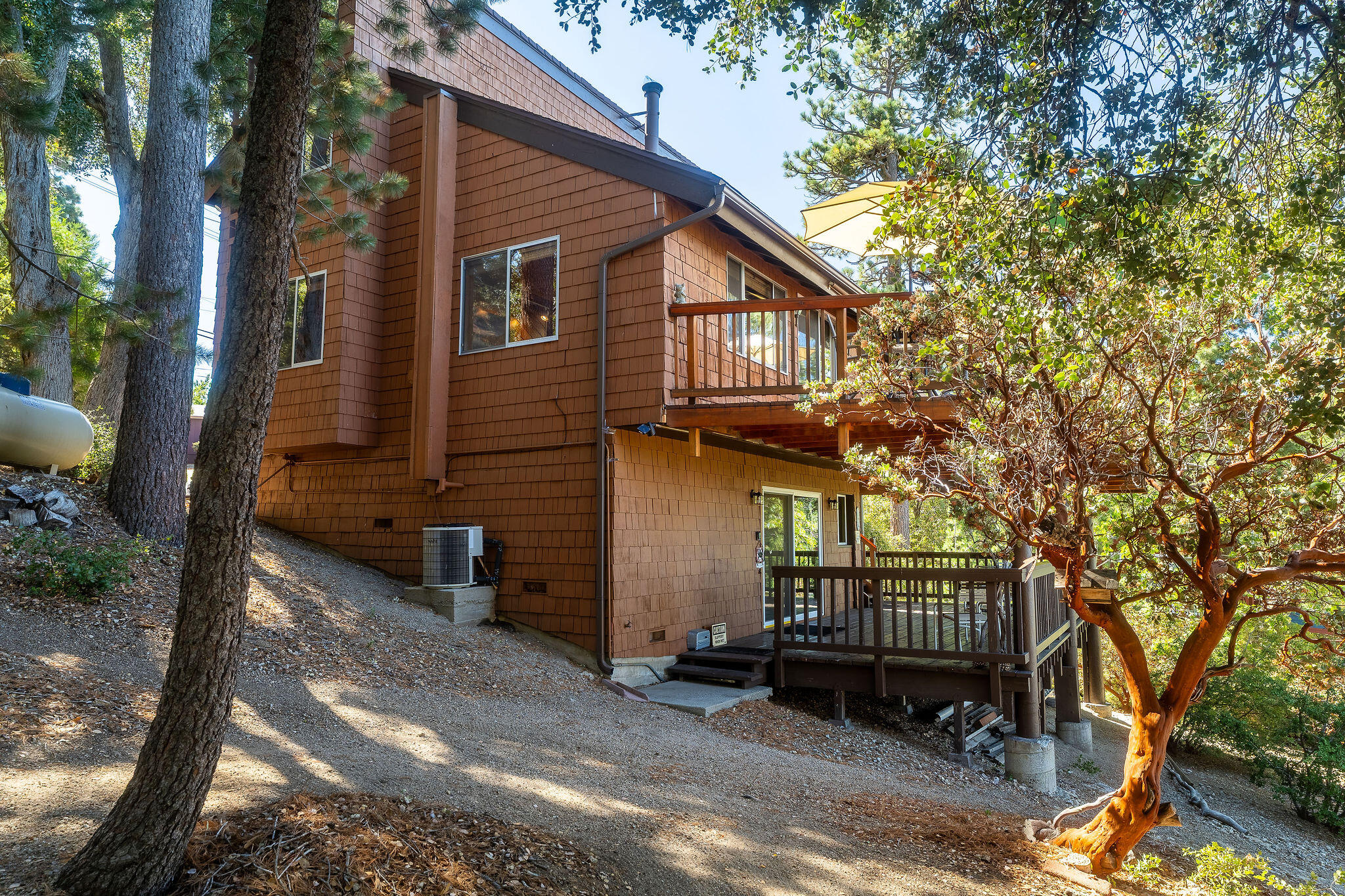 24675 Rocky Point Road Idyllwild, CA 92549 - Photo 38 of 64 a view of a house with a yard and wooden fence