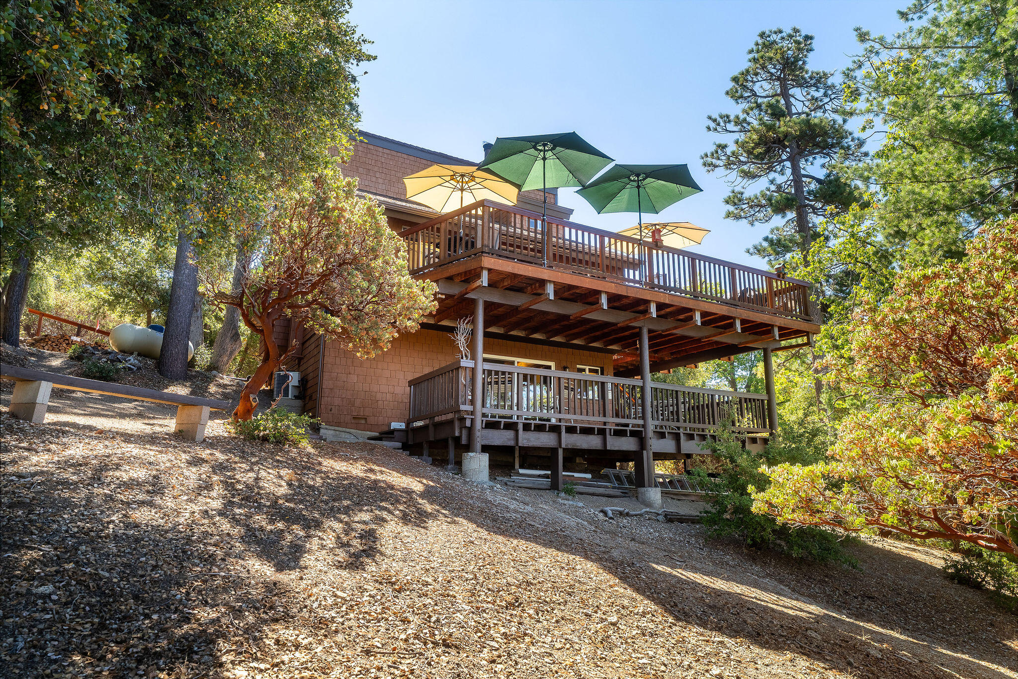24675 Rocky Point Road Idyllwild, CA 92549 - Photo 39 of 64 a view of a chairs and table in the patio