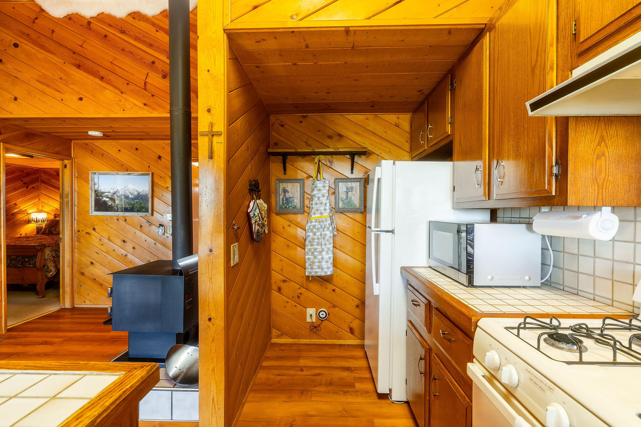 24675 Rocky Point Road Idyllwild, CA 92549 - Photo 5 of 64 a front view of a house with wooden floor and outdoor seating