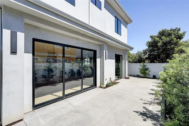 a view of a building with entryway and front door