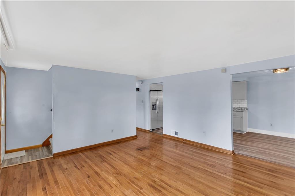 51 Revo Road Pittsburgh, PA 15236 - Photo 7 of 38 The main level is anchored by beautiful hardwoods that create an inviting flow.